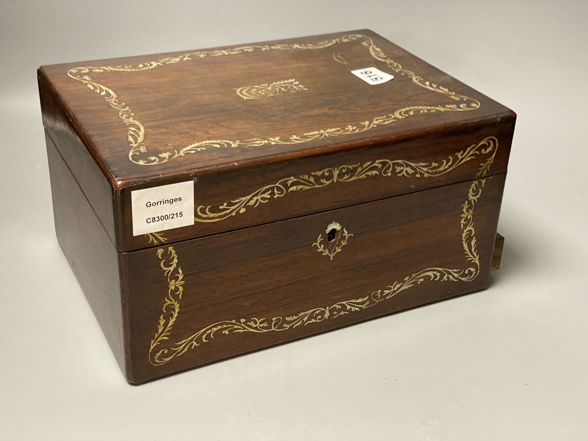 A 19th century mother of pearl inlaid rosewood travelling toilet box